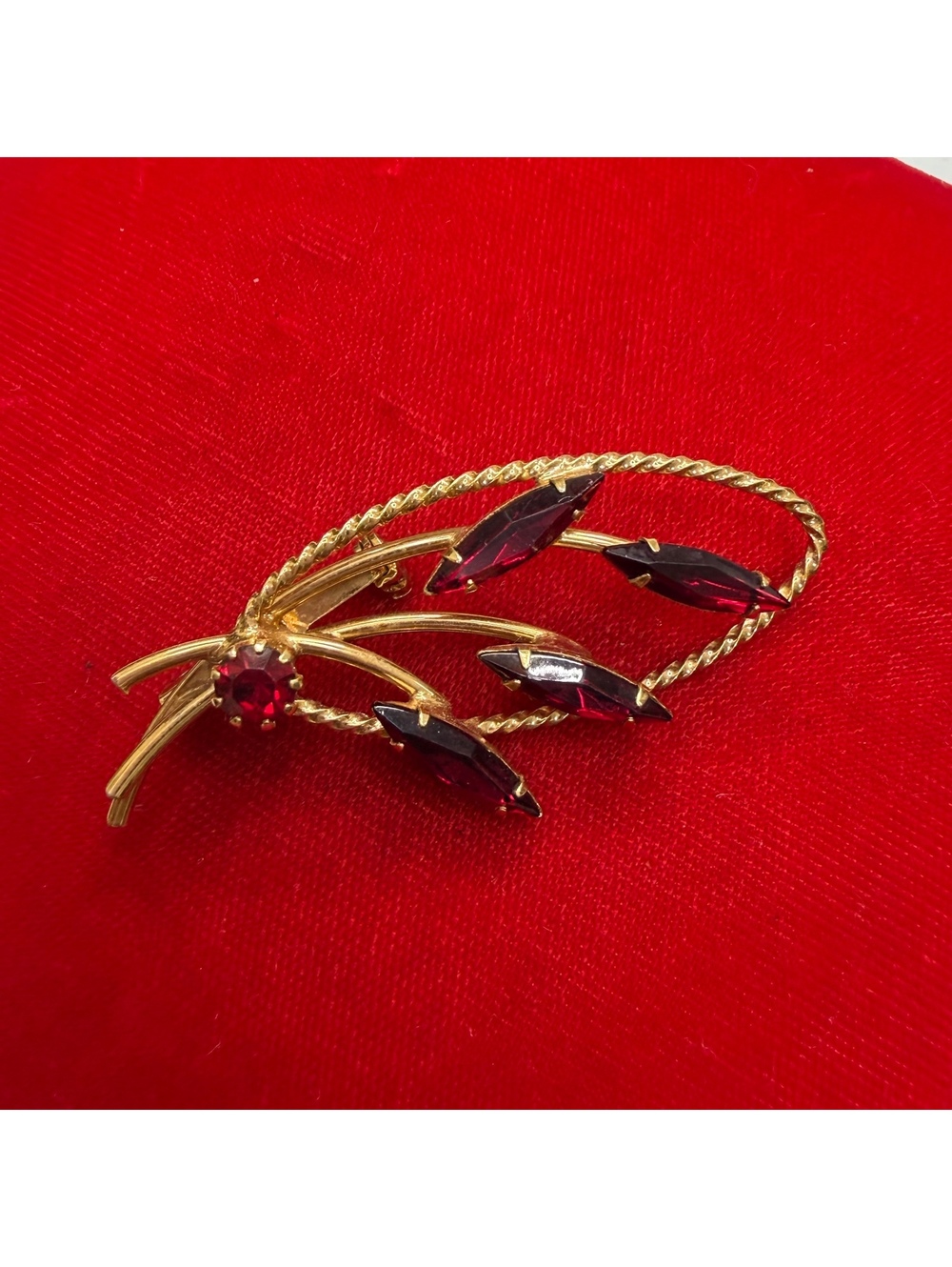 Gold tone red glass rhinestone leaf brooch vintage 60s